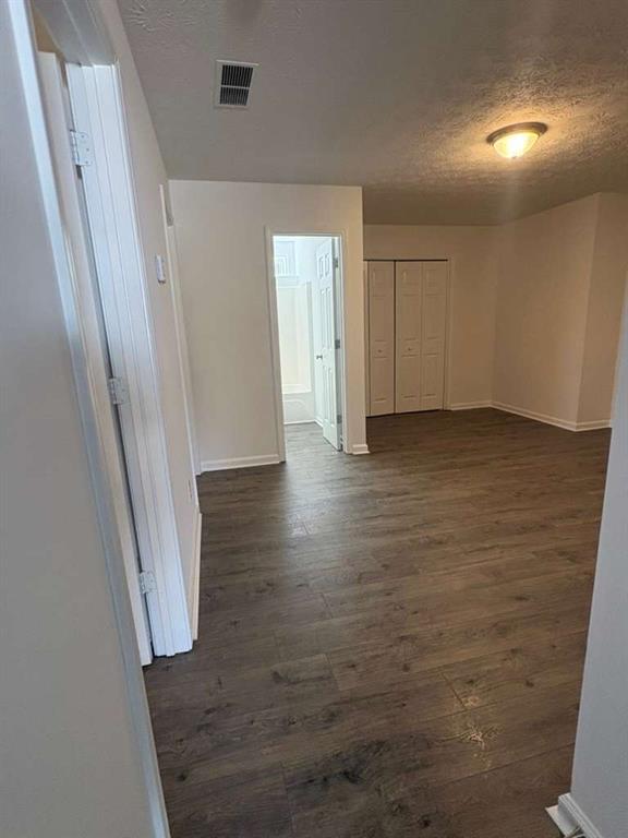 500 Shiver Boulevard Covington, GA 30016 - Photo 19 of 25 an empty room with wooden floor and windows