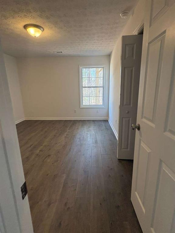 500 Shiver Boulevard Covington, GA 30016 - Photo 20 of 25 an empty room with wooden floor and windows