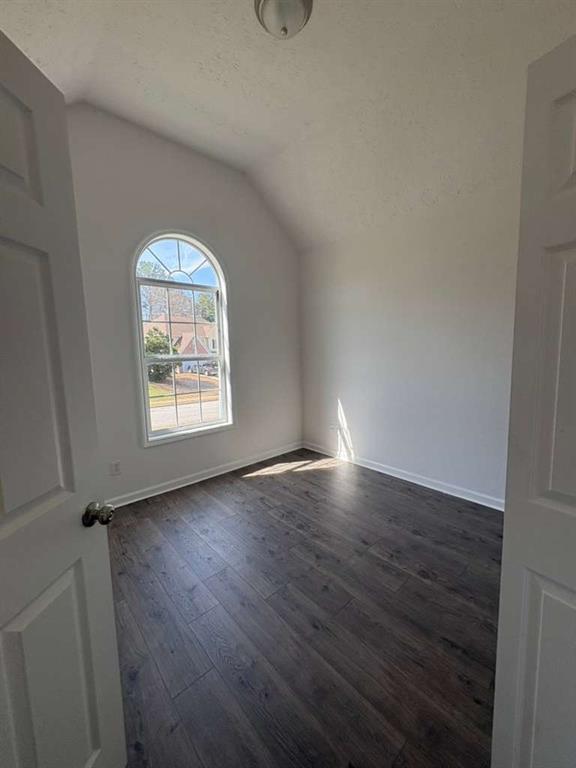 500 Shiver Boulevard Covington, GA 30016 - Photo 22 of 25 an empty room with wooden floor and windows