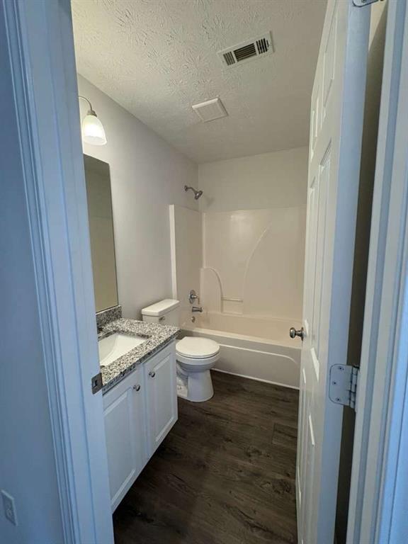 500 Shiver Boulevard Covington, GA 30016 - Photo 25 of 25 a bathroom with a granite countertop sink a toilet and a shower