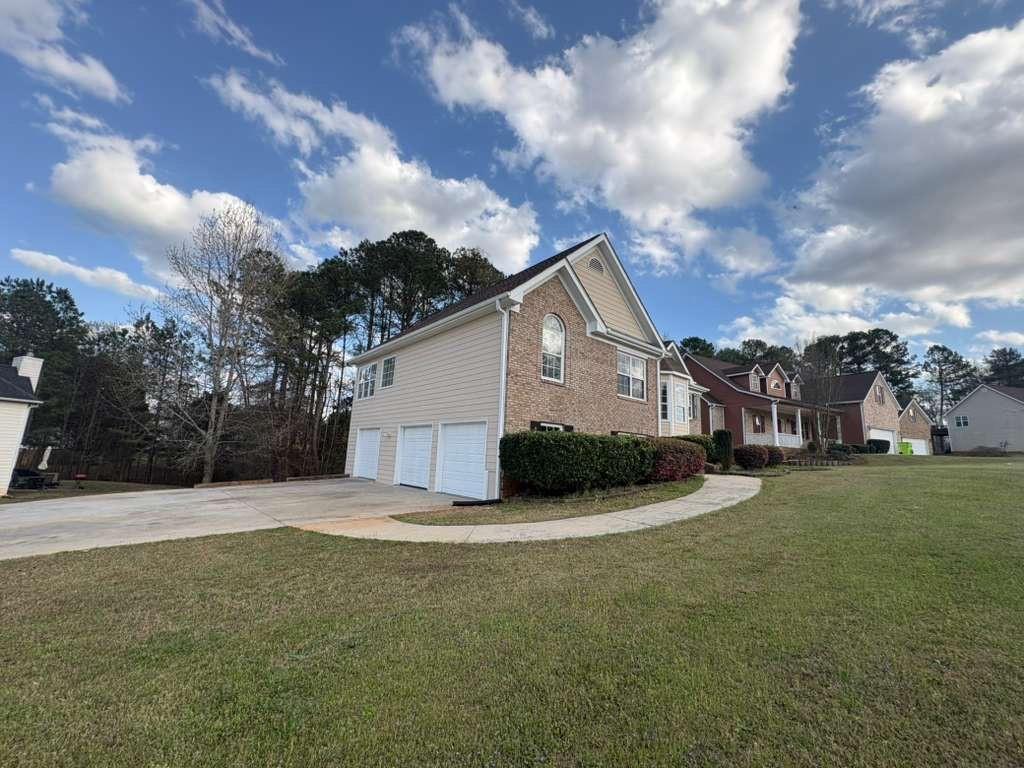 500 Shiver Boulevard Covington, GA 30016 - Photo 3 of 25 a view of a house with a yard