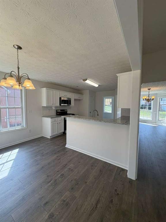 500 Shiver Boulevard Covington, GA 30016 - Photo 9 of 25 a view of a kitchen with furniture and wooden floor