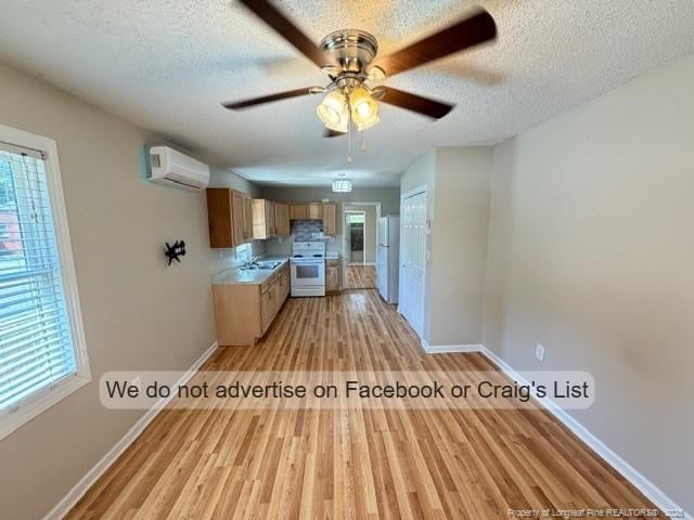 208 Scarborough Street, Unit A Spring Lake, NC 28390 - Photo 2 of 8 a view of kitchen with furniture and wooden floor