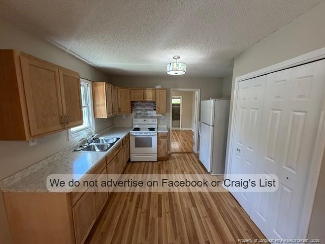 208 Scarborough Street, Unit A Spring Lake, NC 28390 - Photo 3 of 8 a open kitchen with cabinets stove and a refrigerator