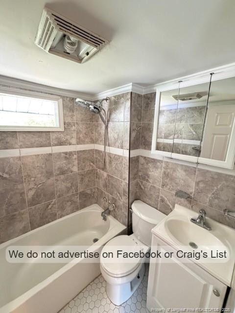 208 Scarborough Street, Unit A Spring Lake, NC 28390 - Photo 5 of 8 a bathroom with a toilet and a shower