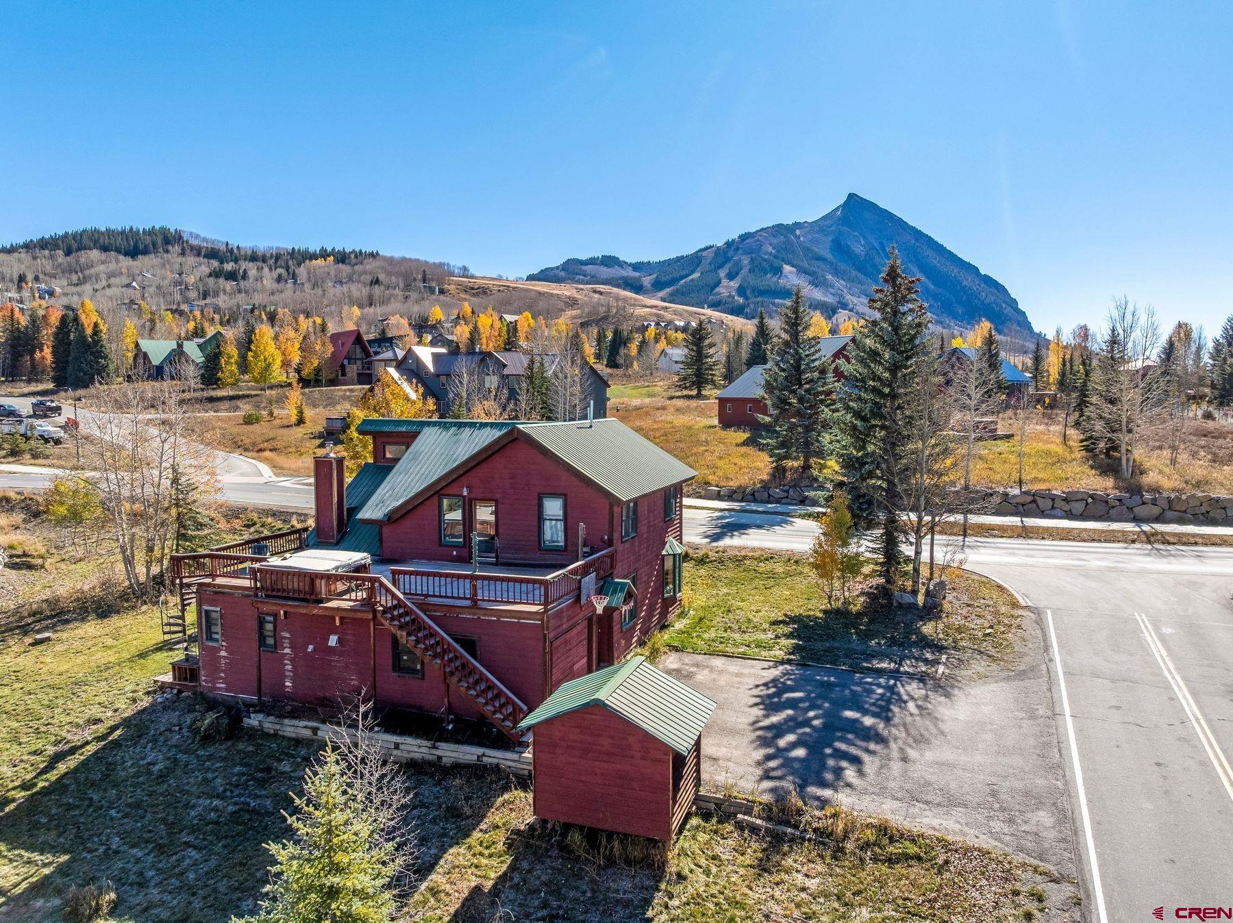 aerial view of a house with a big yard