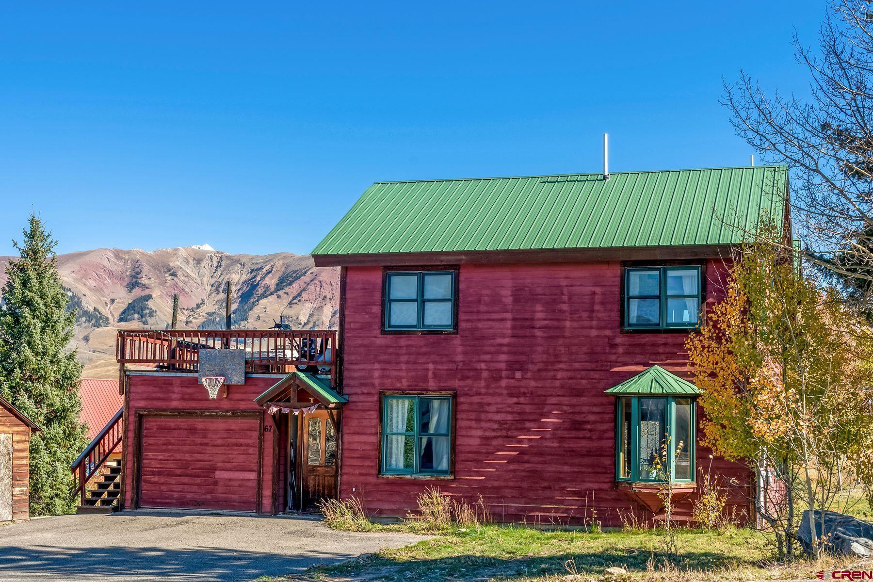 67 Paradise Road Crested Butte, CO 81225 - Photo 17 of 26 a front view of a house with a garden