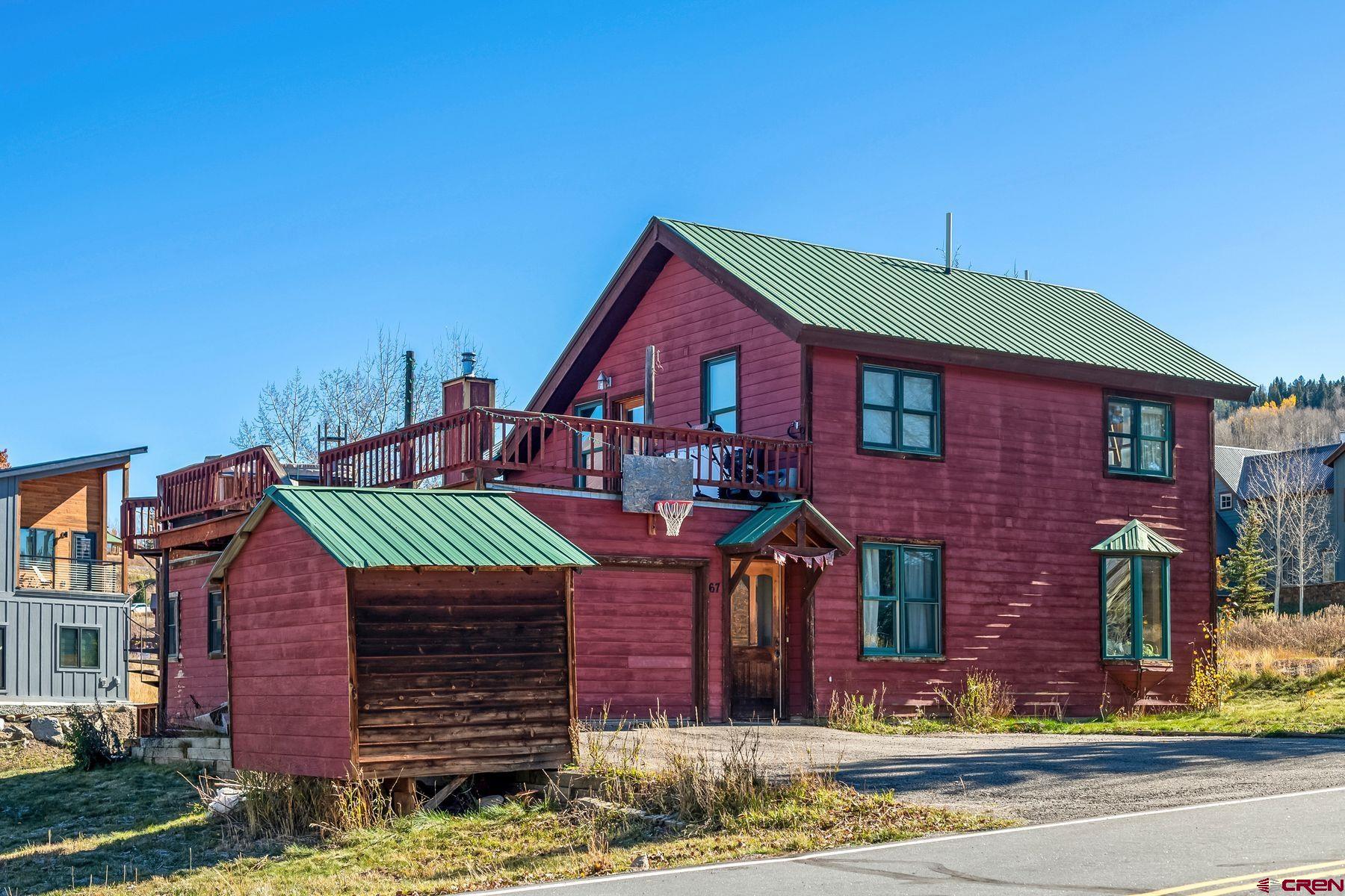 67 Paradise Road Crested Butte, CO 81225 - Photo 18 of 26 a front view of a house with garden