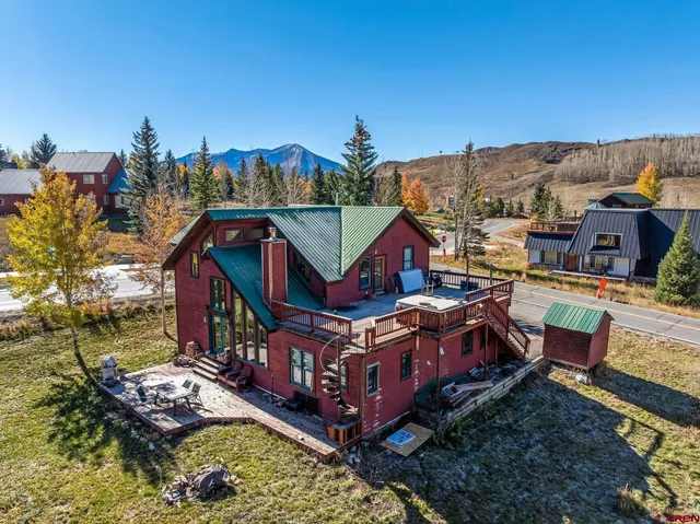 a aerial view of a house with balcony and outdoor space