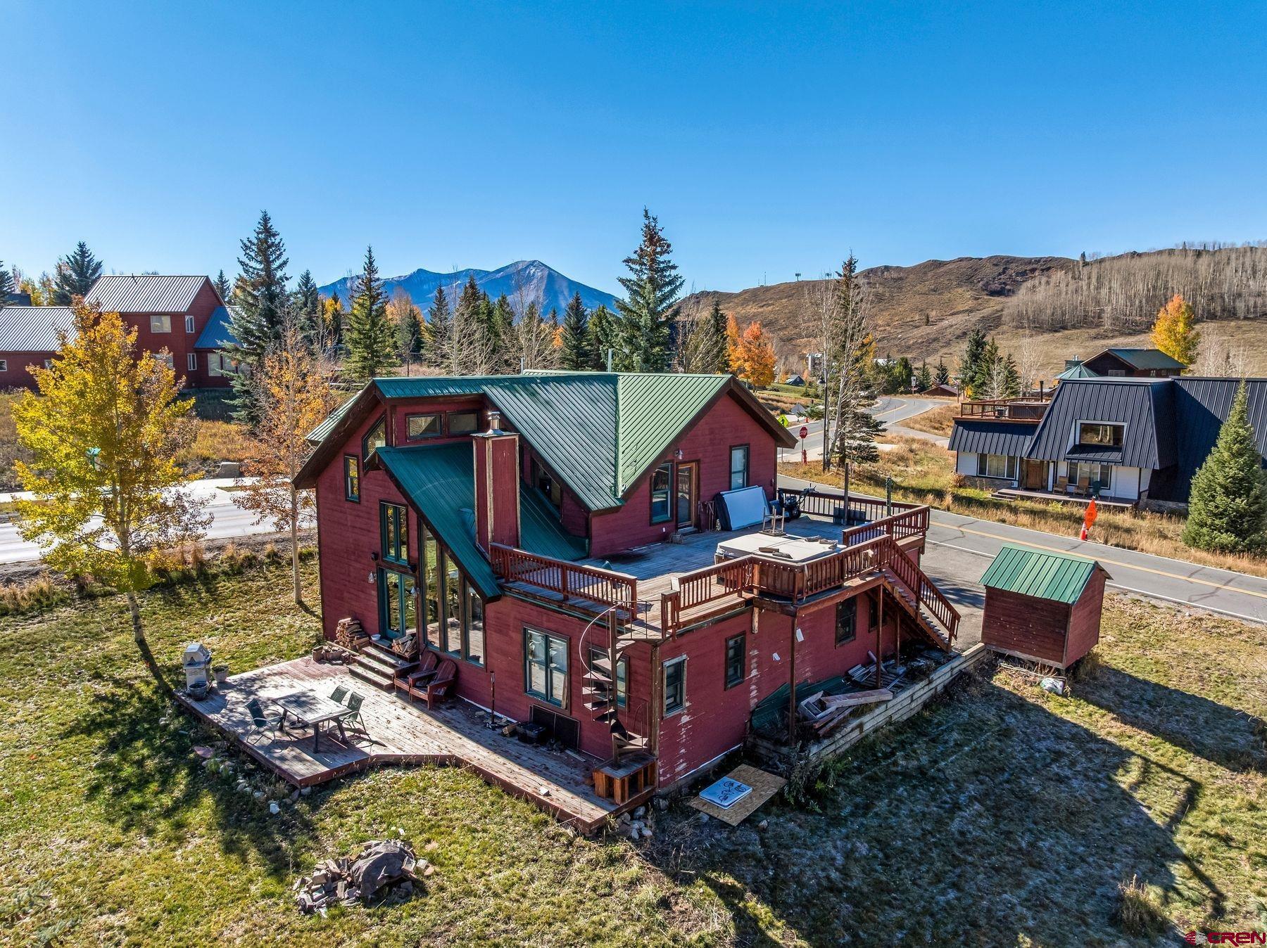 67 Paradise Road Crested Butte, CO 81225 - Photo 19 of 26 a aerial view of a house with balcony and outdoor space