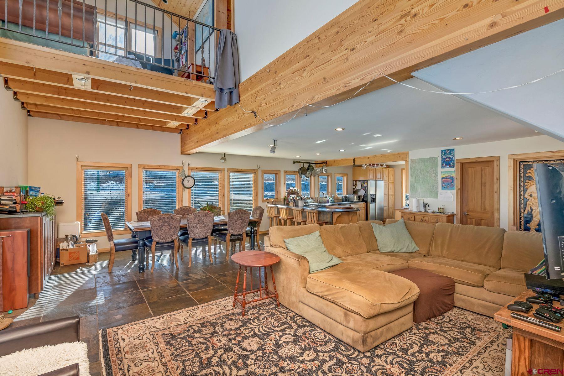 67 Paradise Road Crested Butte, CO 81225 - Photo 3 of 26 a living room with lots of furniture and a rug