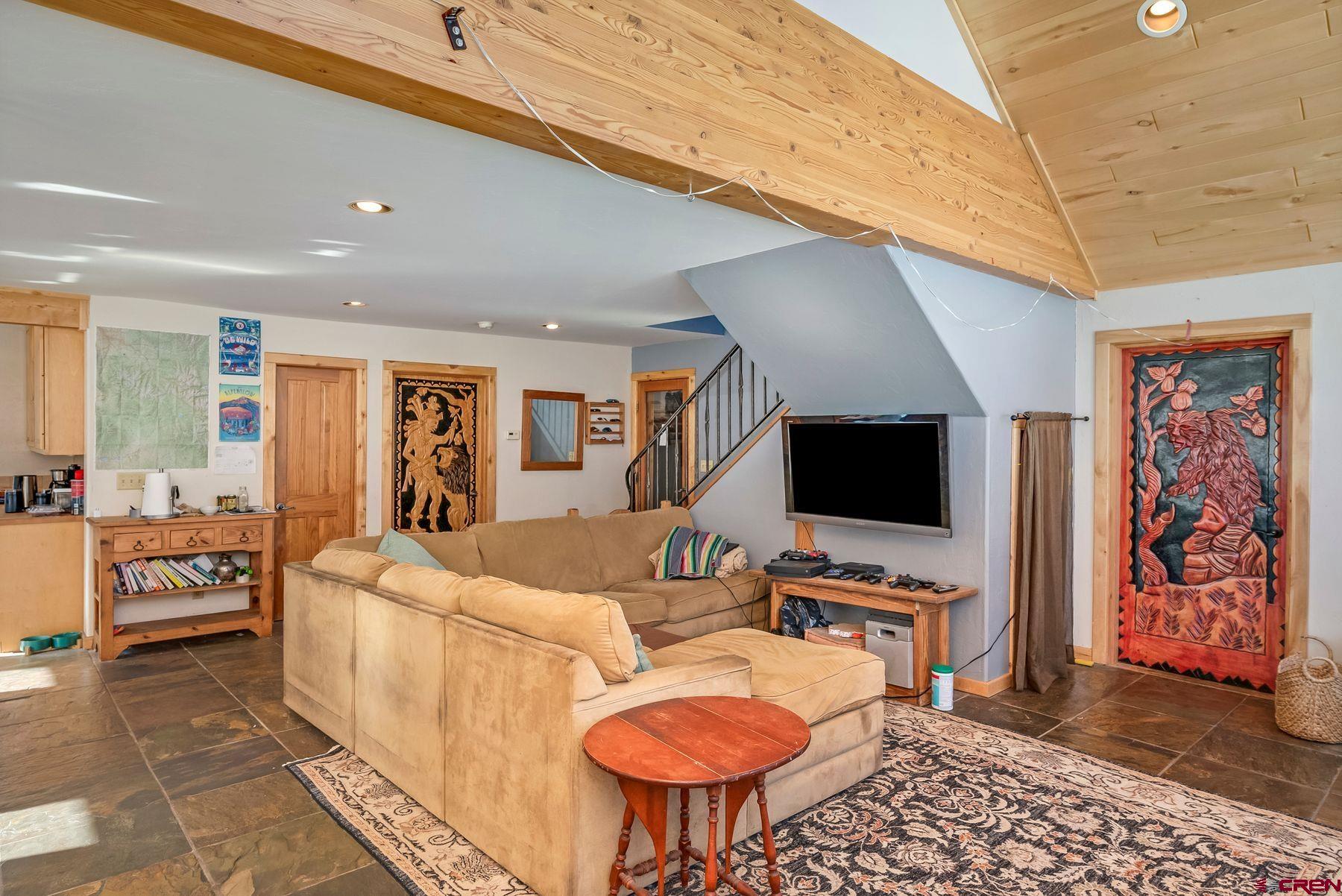 67 Paradise Road Crested Butte, CO 81225 - Photo 4 of 26 a living room with furniture and a flat screen tv