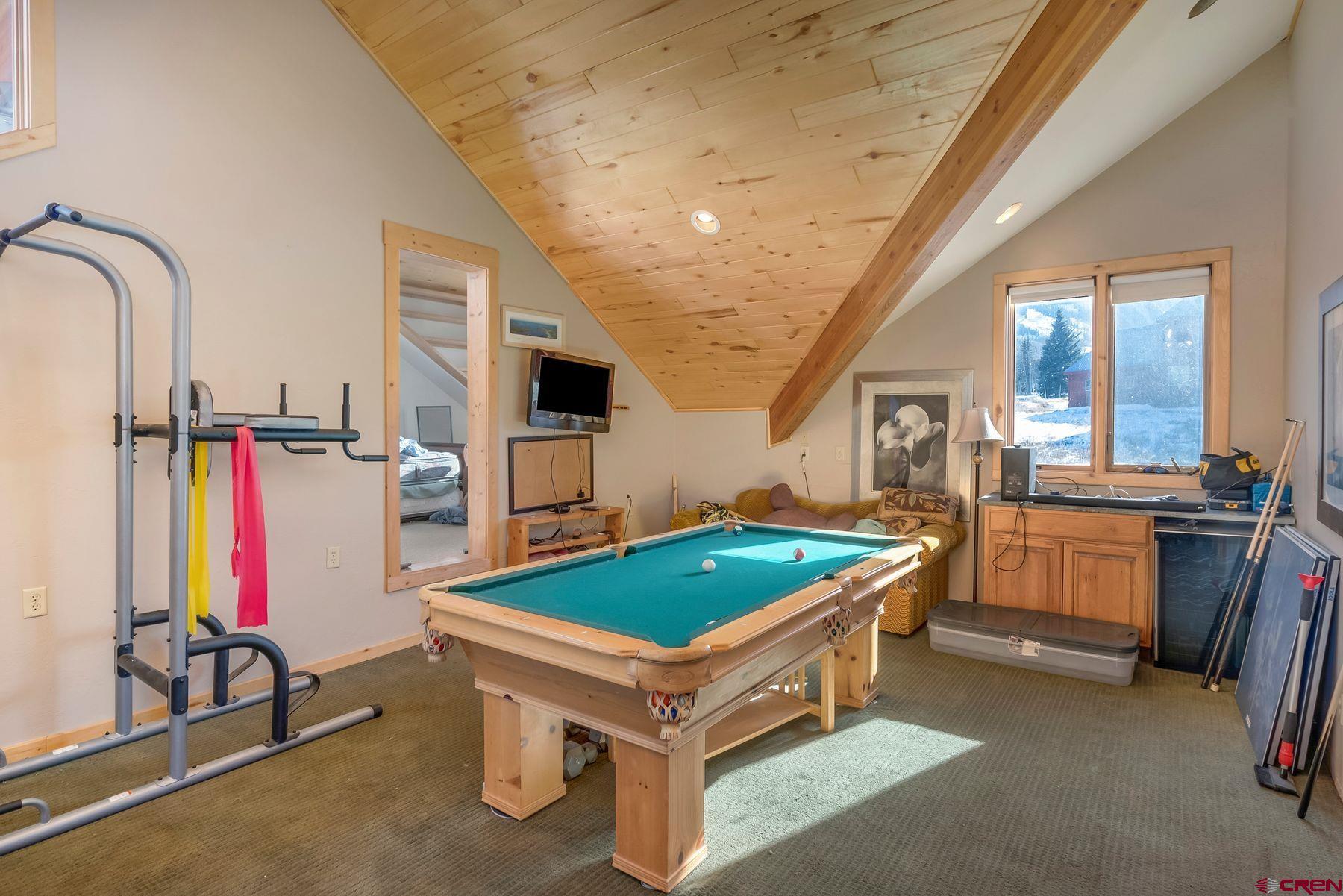 67 Paradise Road Crested Butte, CO 81225 - Photo 9 of 26 a room with furniture and air hockey table