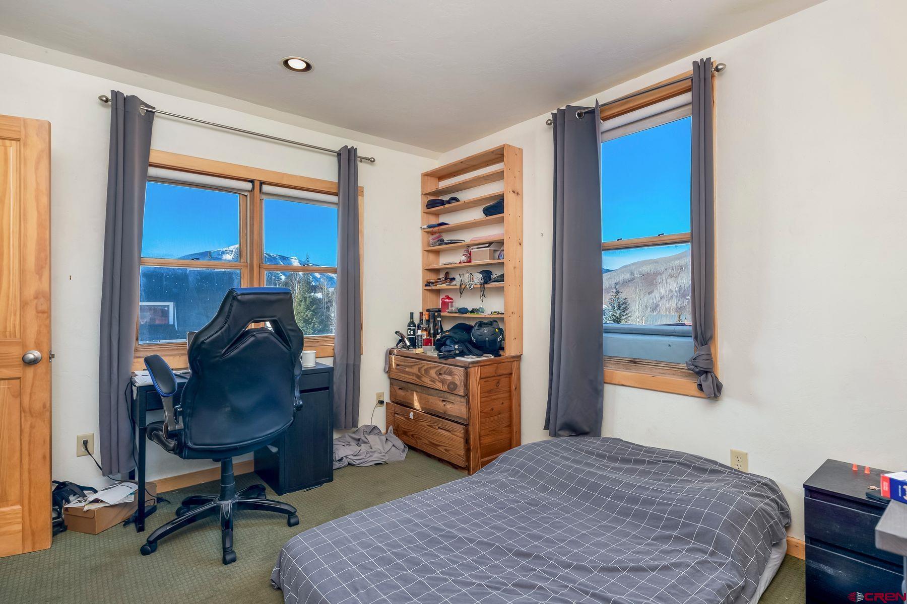 67 Paradise Road Crested Butte, CO 81225 - Photo 10 of 26 a bedroom with furniture and a window