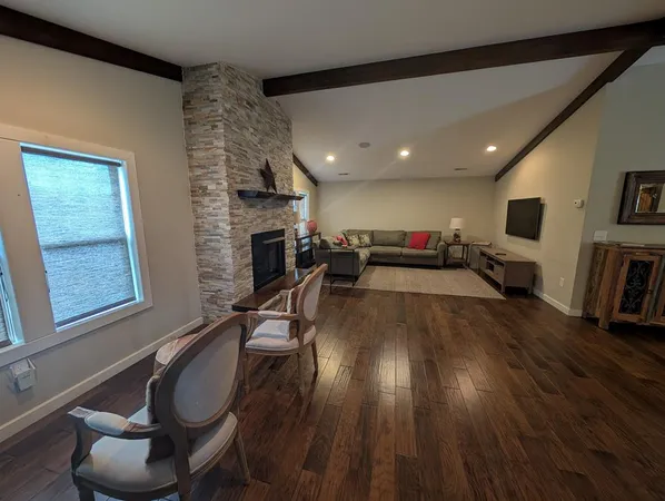 a kitchen with a table and chairs in it