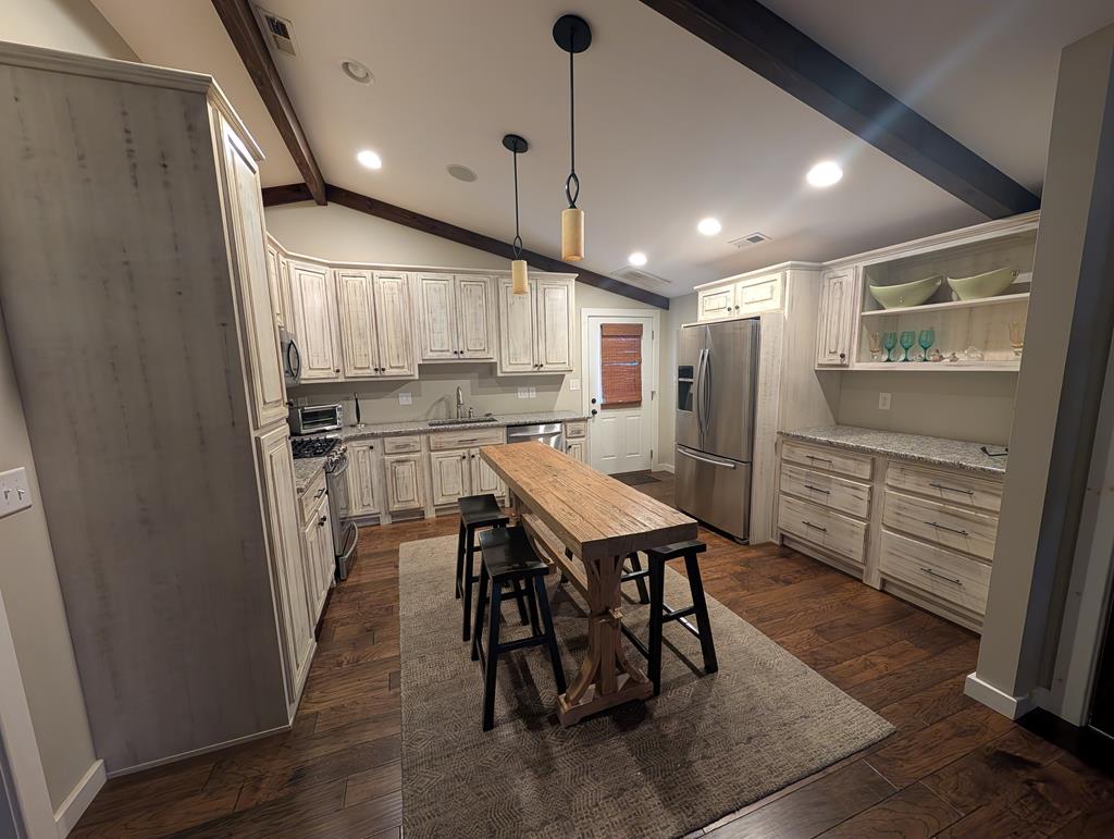 158 Mountain Street Blue Ridge, GA 30513 - Photo 13 of 14 a kitchen with a table and chairs in it