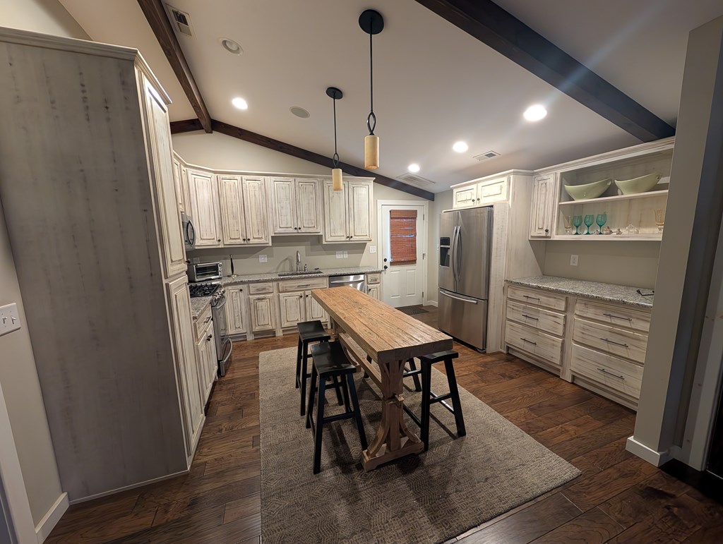 158 Mountain Street Blue Ridge, GA 30513 - Photo 2 of 14 a kitchen with a table and chairs in it