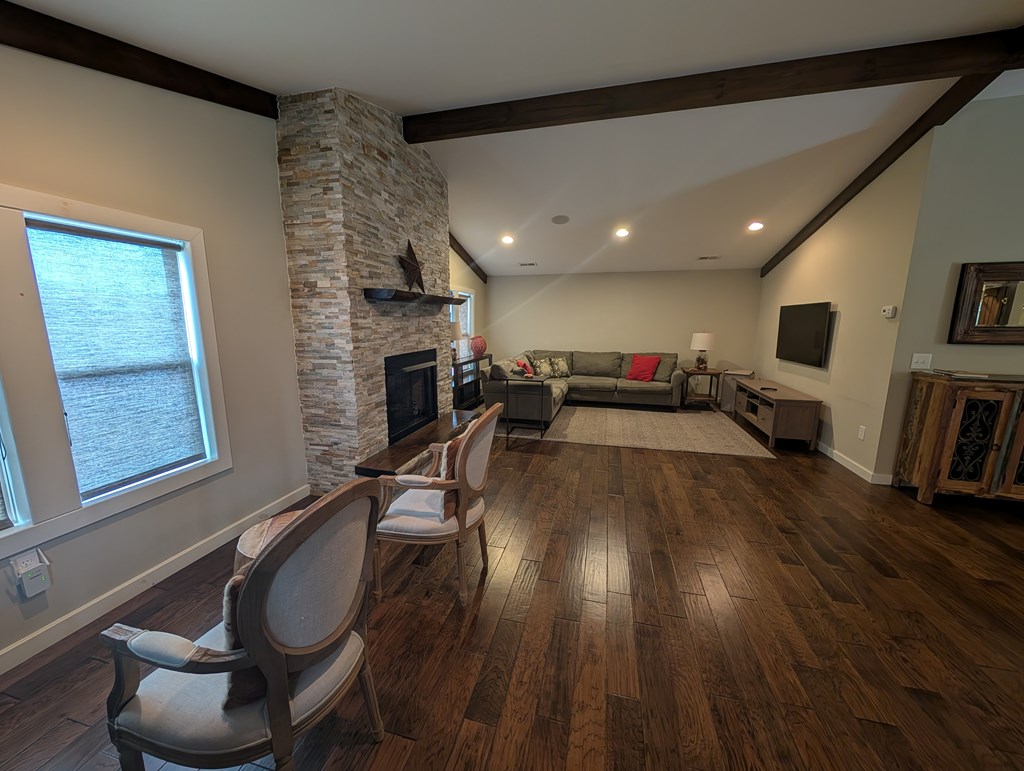 158 Mountain Street Blue Ridge, GA 30513 - Photo 3 of 14 a living room with furniture and a fireplace