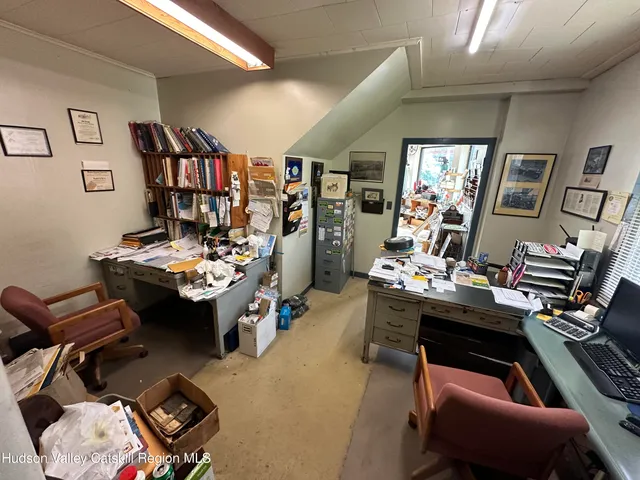 a view of a workspace with furniture and toys