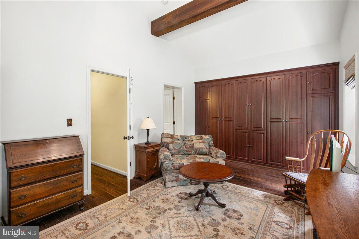 19266 Mockingbird Heights Road Triangle, VA 22172 - Photo 17 of 35 a living room with furniture a rug and white walls