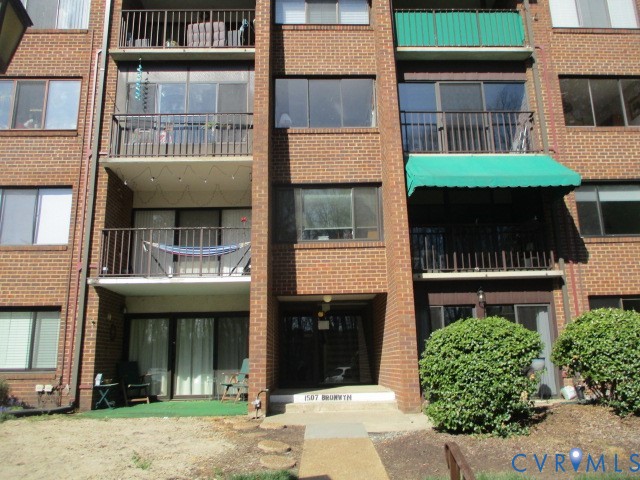 1507 Bronwyn Road, Unit 301 Henrico, VA 23238 - Photo 3 of 41 a front view of a brick house with a large windows