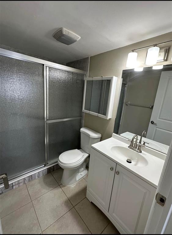 960 Apollo Beach Boulevard, Unit 102 Apollo Beach, FL 33572 - Photo 5 of 8 a bathroom with a sink toilet and shower