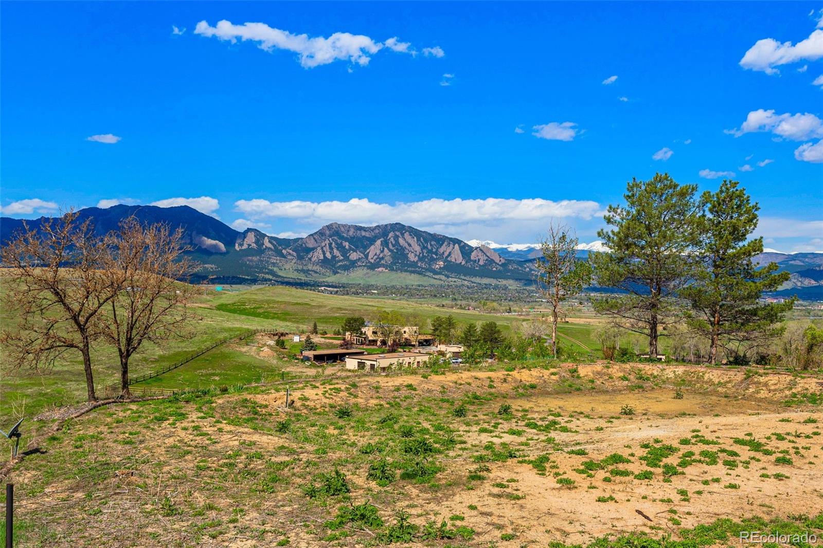 8 Benchmark Drive Boulder, CO 80303 - Photo 20 of 32 a view of a lake with a mountain in the background
