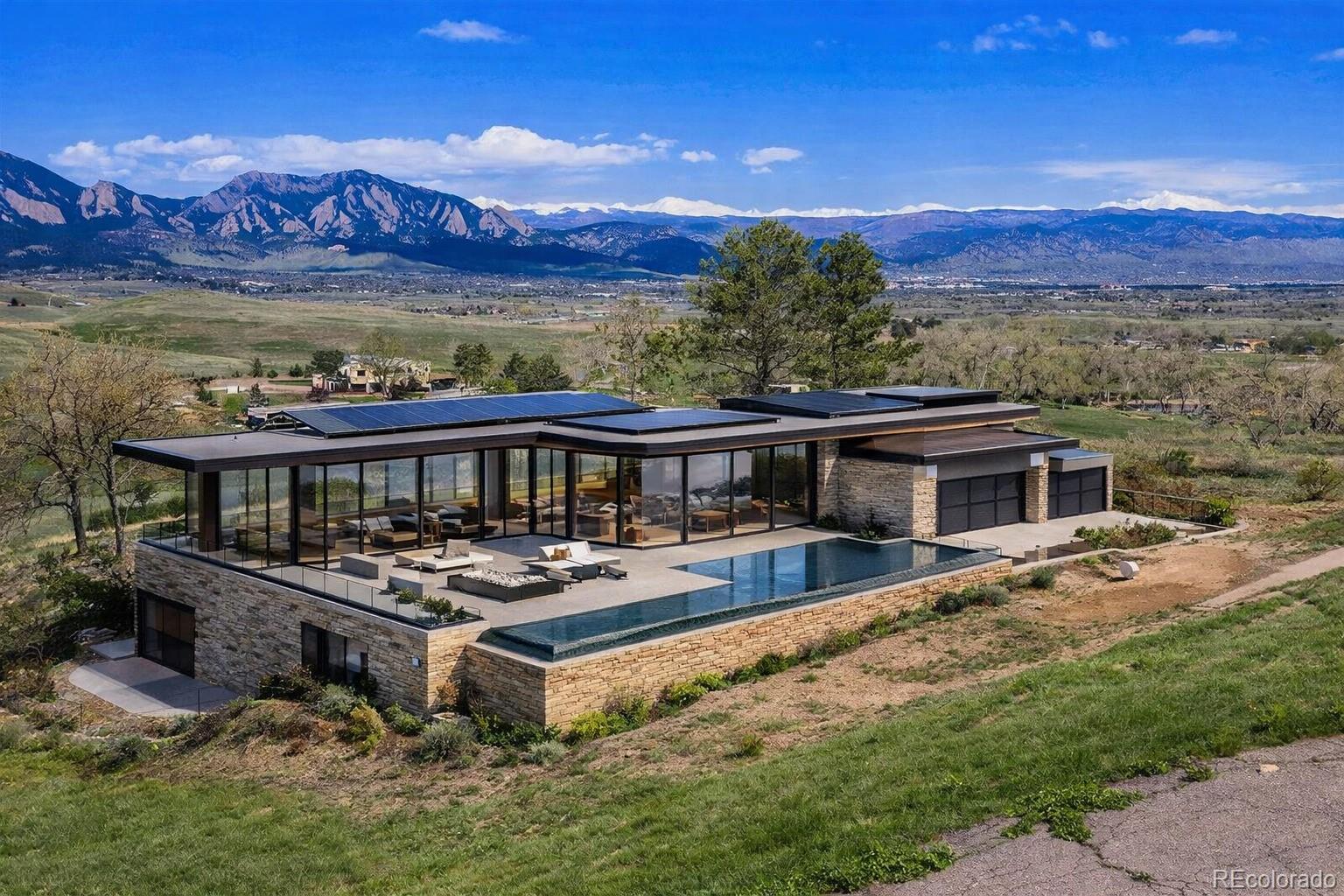 8 Benchmark Drive Boulder, CO 80303 - Photo 3 of 38 front view of a house with a ocean view