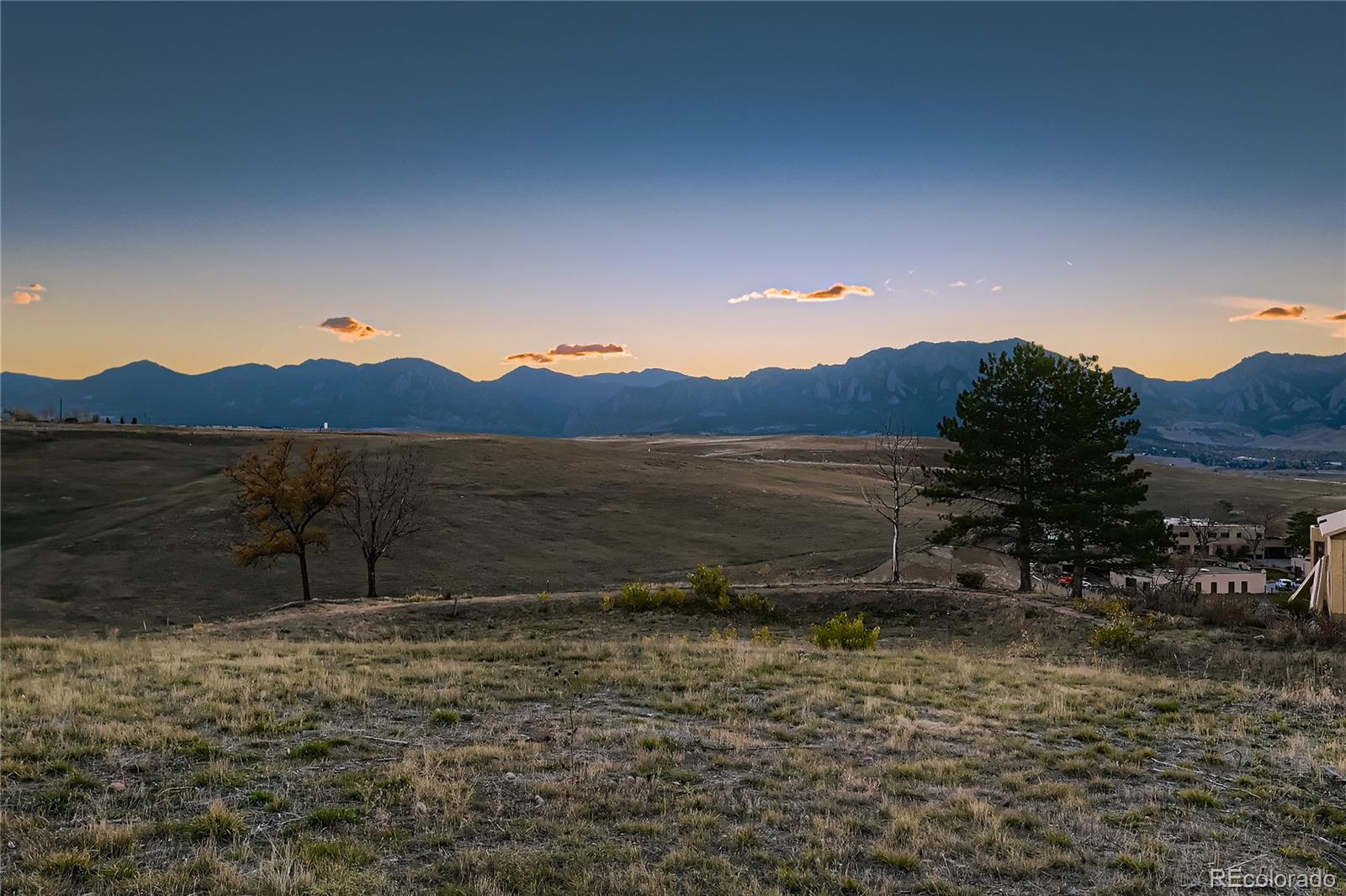 8 Benchmark Drive Boulder, CO 80303 - Photo 6 of 32 a view of a dry yard with wooden fence