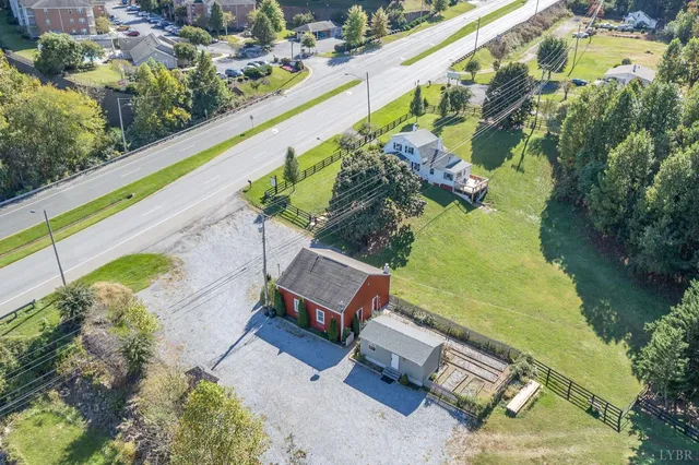 a view of a swimming pool with a yard