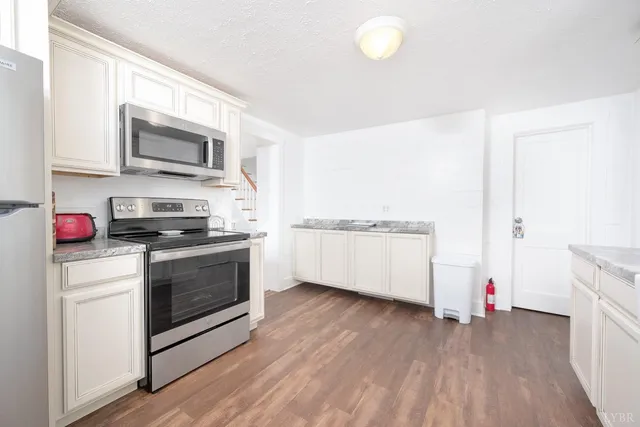 a bedroom with two beds and a large window