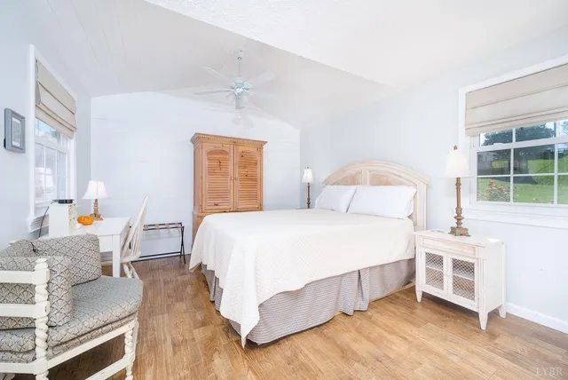 a bedroom with a bed and a table with rug