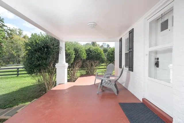 a living room with furniture cabinets and wooden floor