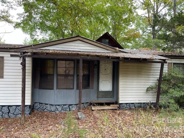 1139 Calhoun Trail Rutherfordton, NC 28139 - Photo 3 of 21 a front view of a house with trees