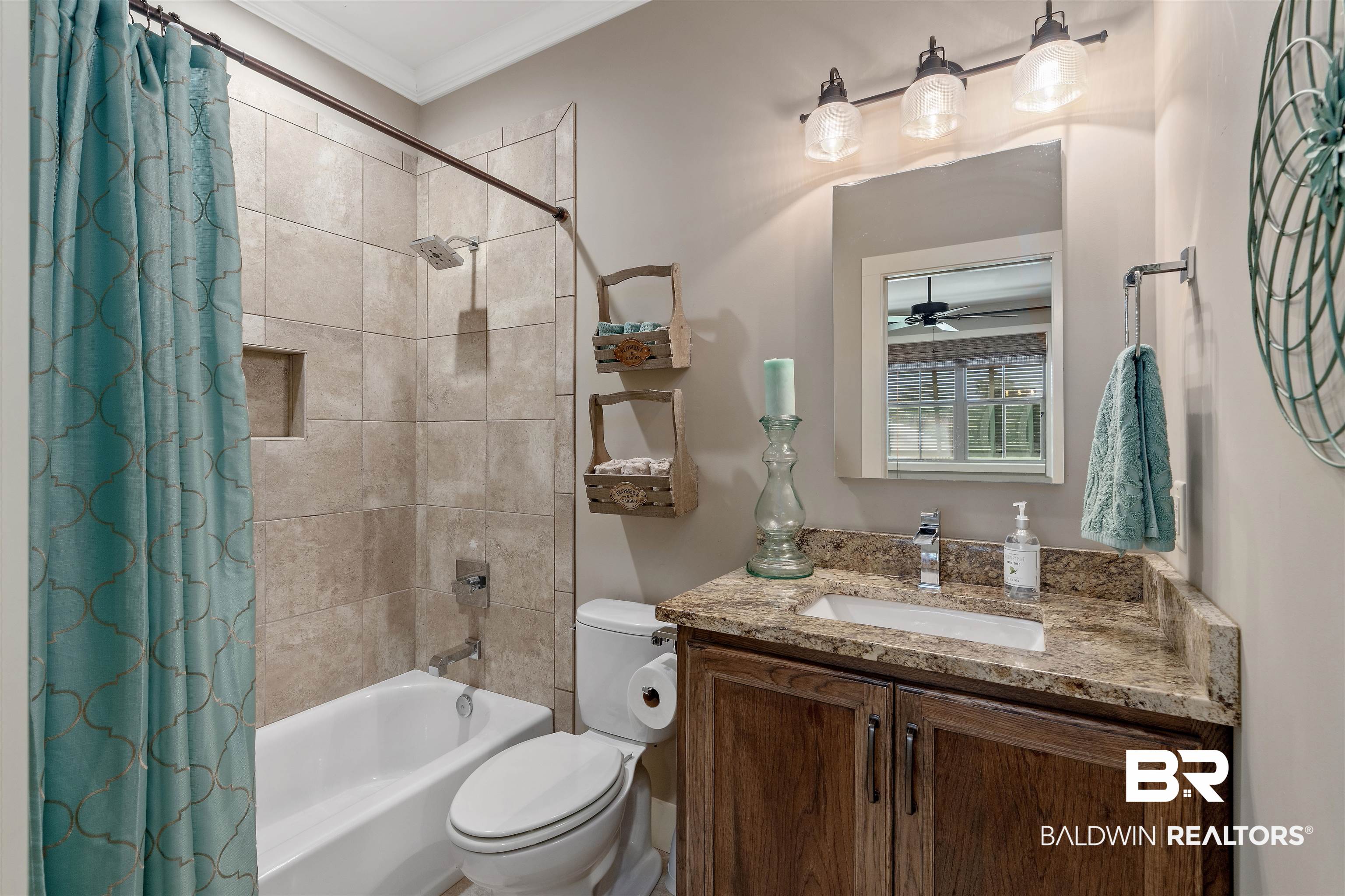 8753 Bishop Road Fairhope, AL 36532 - Photo 35 of 59 Bathroom featuring a tub/shower combination with tiled surround and built-in niche