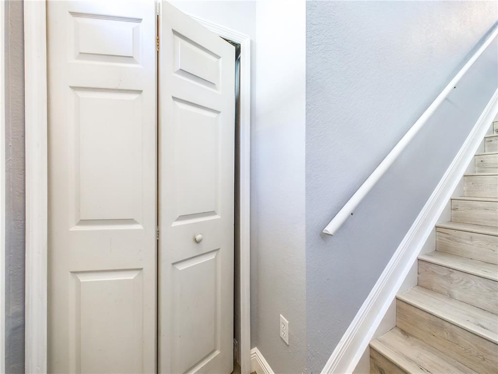 5521 Rosehill Road, Unit 203 Sarasota, FL 34233 - Photo 3 of 51 a view of staircase with white walls and white door