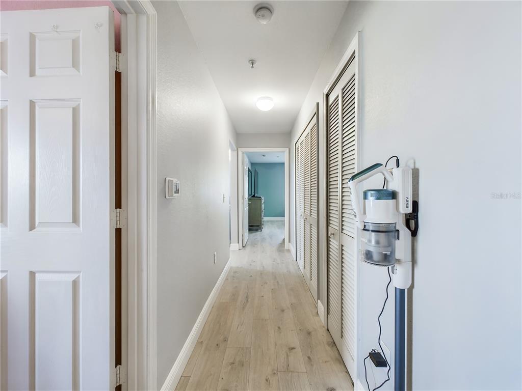 5521 Rosehill Road, Unit 203 Sarasota, FL 34233 - Photo 34 of 51 a view of a hallway with wooden floor and staircase
