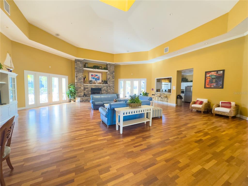 5521 Rosehill Road, Unit 203 Sarasota, FL 34233 - Photo 46 of 51 a living room with furniture and wooden floor
