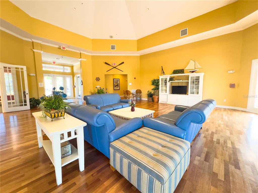 5521 Rosehill Road, Unit 203 Sarasota, FL 34233 - Photo 47 of 51 a living room with patio furniture and a flat screen tv