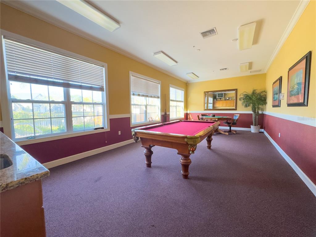 5521 Rosehill Road, Unit 203 Sarasota, FL 34233 - Photo 49 of 51 a living room with furniture and large windows