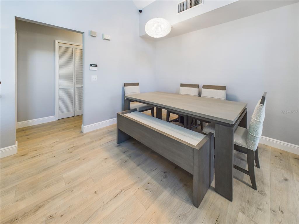 5521 Rosehill Road, Unit 203 Sarasota, FL 34233 - Photo 6 of 51 a view of a room with wooden floor and furniture