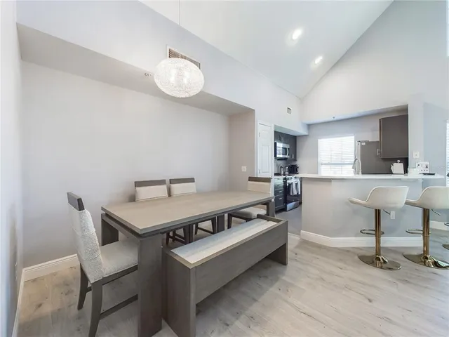 a view of a livingroom with furniture and a table