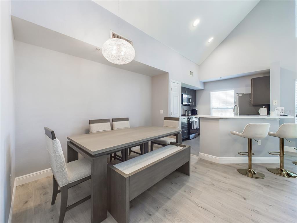 5521 Rosehill Road, Unit 203 Sarasota, FL 34233 - Photo 7 of 51 a view of a livingroom with furniture and a table