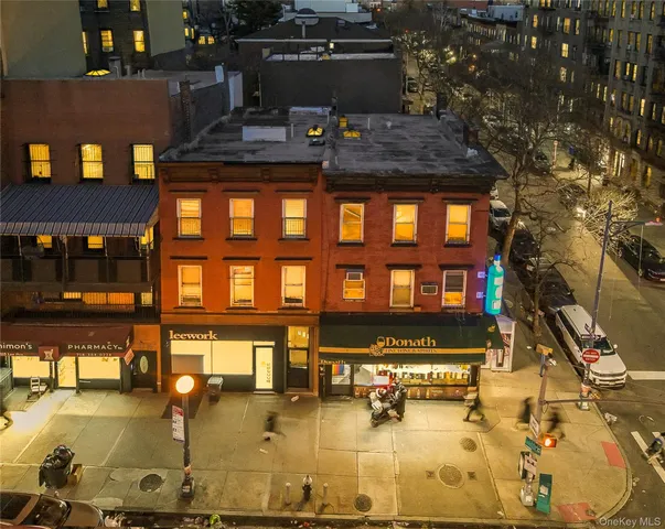 a view of a swimming pool with outdoor seating
