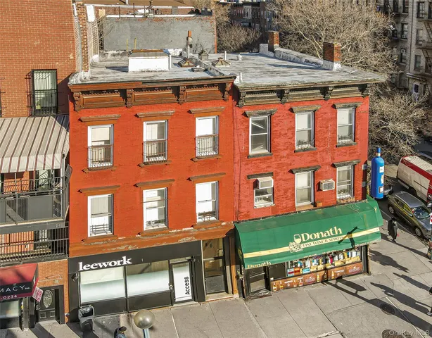 a front view of a building with glass windows