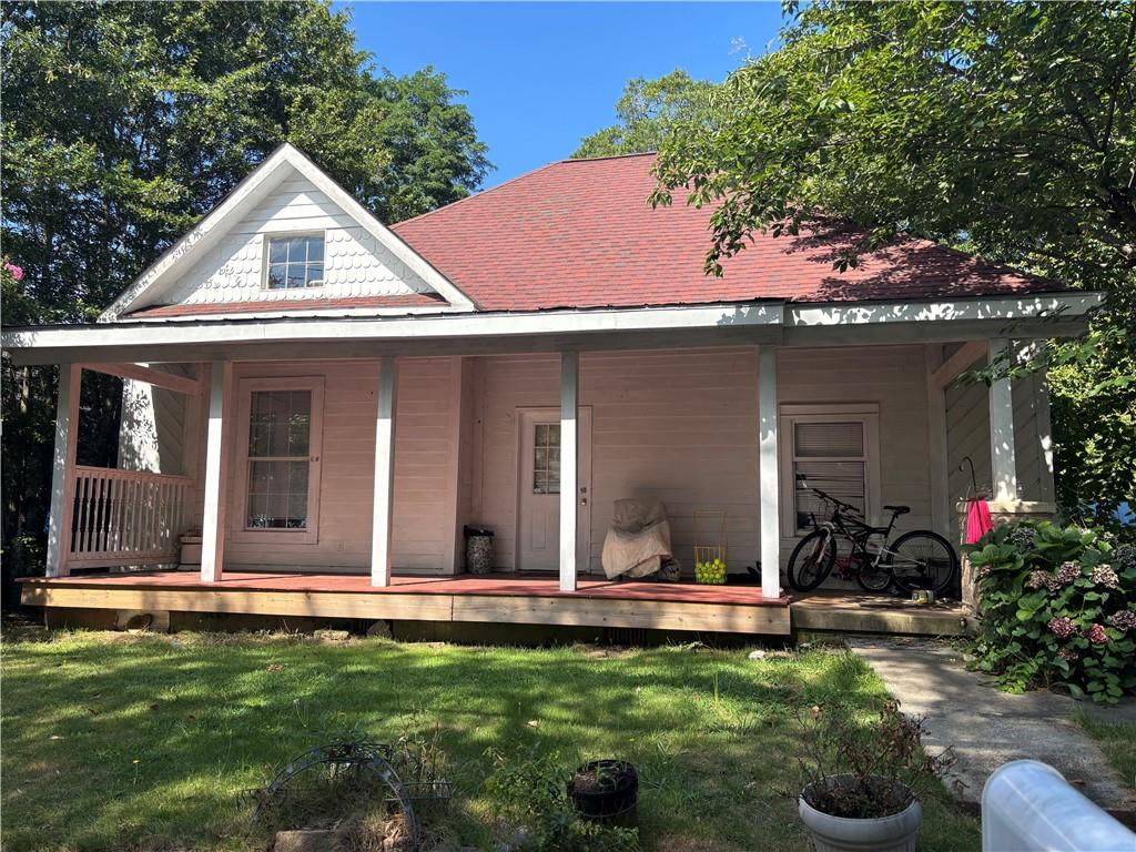 1090 Forrest Avenue Stone Mountain, GA 30083 - Photo 11 of 13 a front view of a house with garden