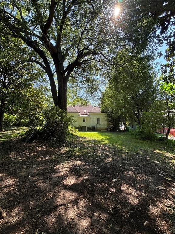 1090 Forrest Avenue Stone Mountain, GA 30083 - Photo 13 of 13 a view of a yard with trees