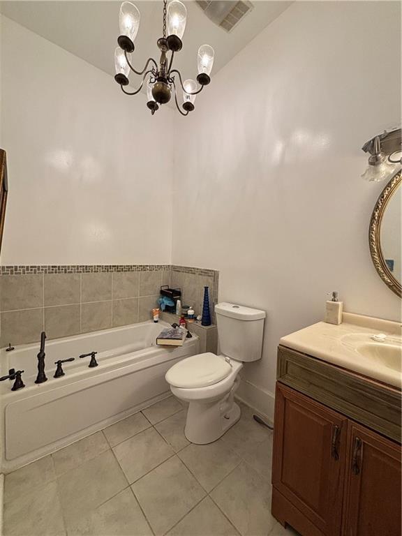1090 Forrest Avenue Stone Mountain, GA 30083 - Photo 6 of 13 a bathroom with a toilet a sink and a mirror