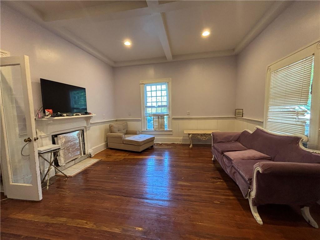 1090 Forrest Avenue Stone Mountain, GA 30083 - Photo 7 of 13 a living room with furniture and a flat screen tv