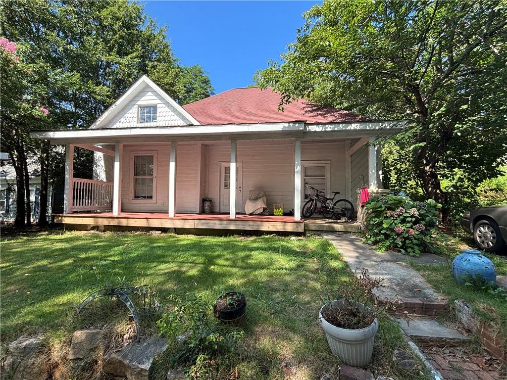 1090 Forrest Avenue Stone Mountain, GA 30083 - Photo 10 of 13 a view of a house with backyard swimming pool and sitting area